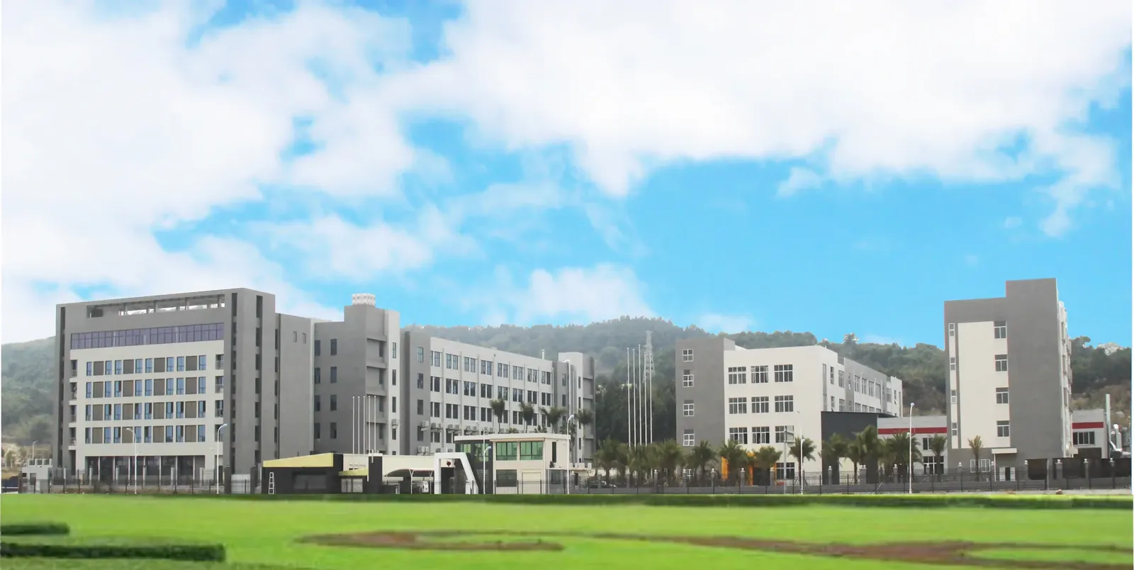 Wide exterior view of the manufacturing campus and production buildings