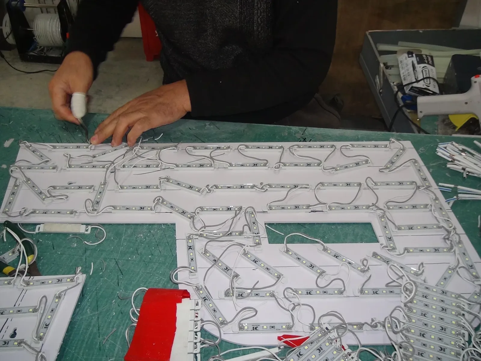 LED modules and wiring installed inside an illuminated sign panel