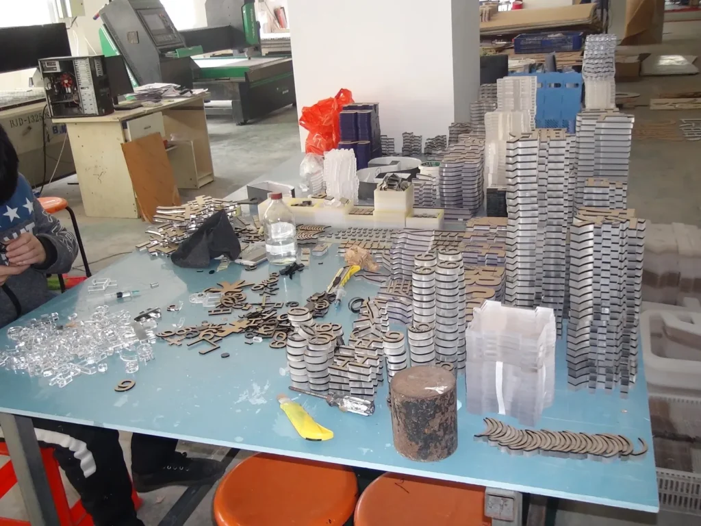 Batch of repeated custom sign components prepared for assembly
